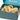 A Voyager gift box containing three hemp dog toys: a ball with a long loop, a ball with two loops, and a ball with a pull handle. 